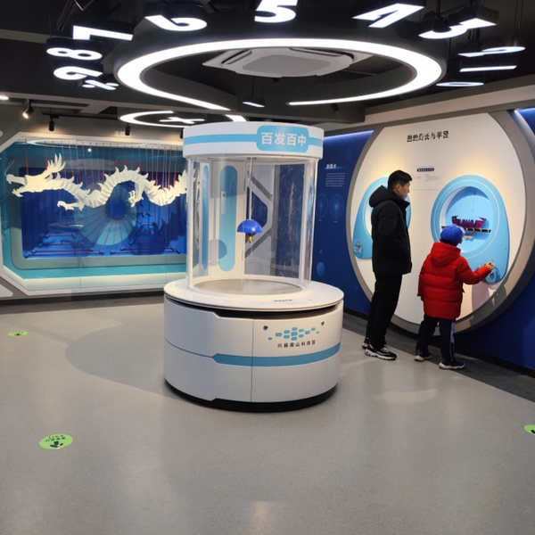 Children interacting with hands-on science exhibits in a modern science museum environment