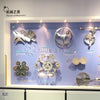 Interactive mechanics wall display showcasing classical motion principles