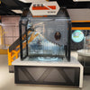 Hands-on serpentine pendulum exhibit installed in a science museum environment
