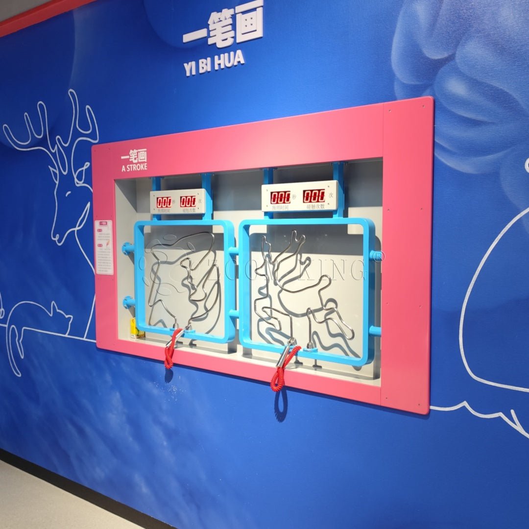 Visitor using one line drawing interactive exhibit in science museum