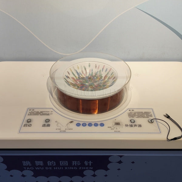 Magnetic force causing object motion in interactive science exhibit