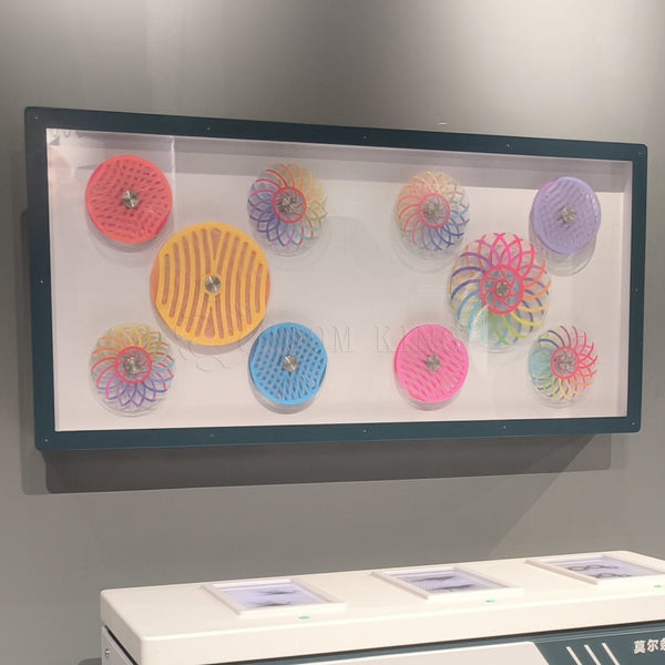 Moiré pattern interactive touch panel exhibit demonstrating visual illusion effects in a science center