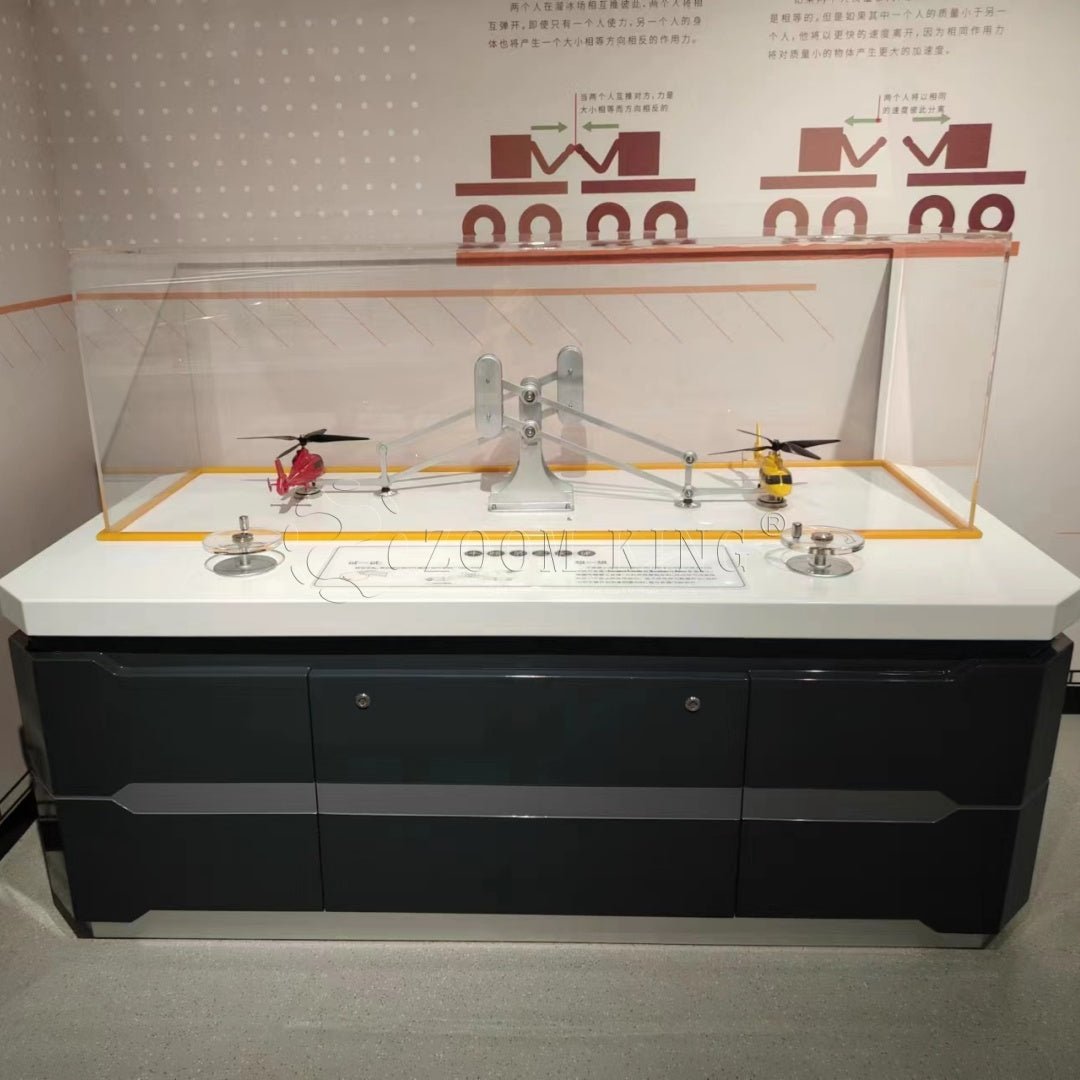 Newton’s three laws interactive physics exhibit demonstrating action and reaction forces