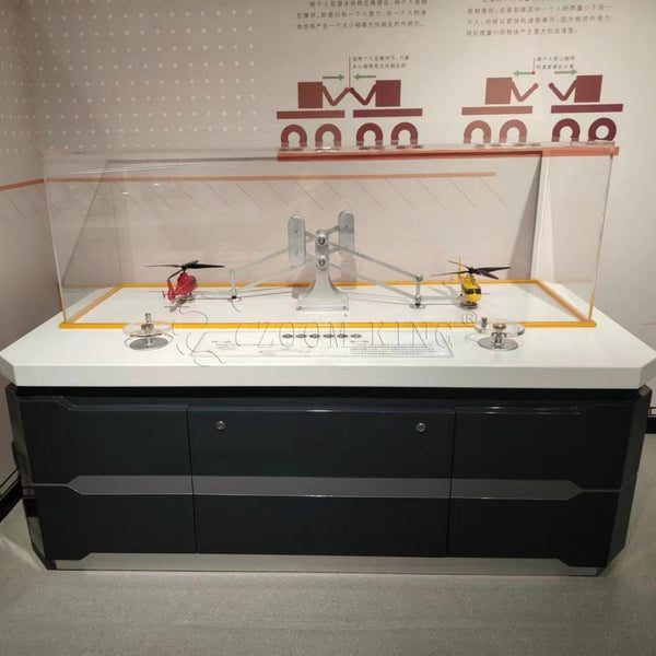 Newton’s three laws interactive physics exhibit demonstrating action and reaction forces