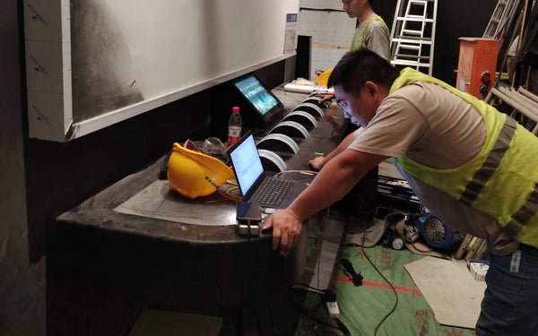 On-site installation of interactive science museum exhibits by professional manufacturer