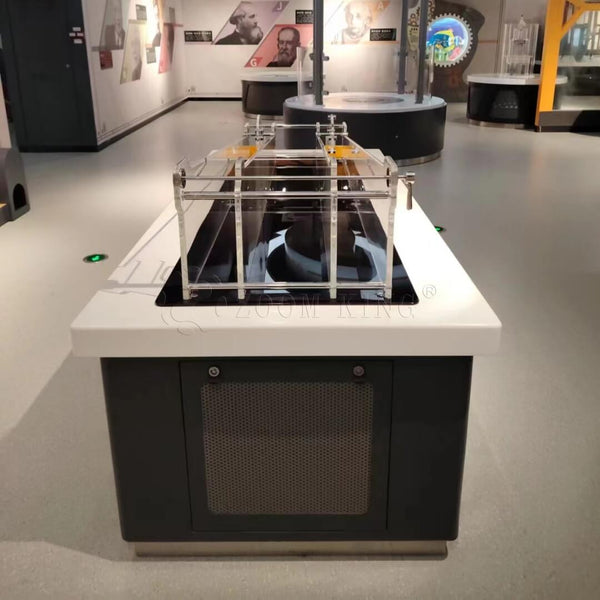 Visitors participating in slope race inertia experiment interactive exhibit- Zigong Zhongqing Technology Co., Ltd. Operating under the brand Zoomking®.