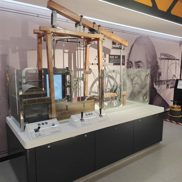 Mechanical linkage and transmission system of a steam engine science exhibit