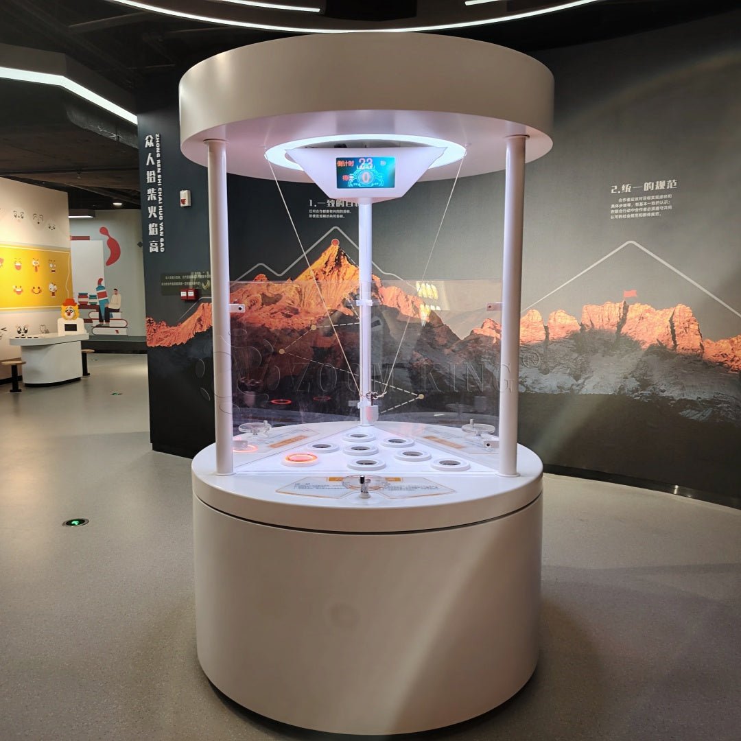 Teamwork ball control area in cooperative interactive science exhibit